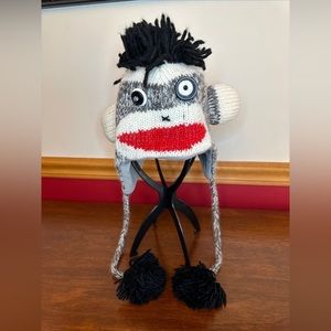 Monkey Fleece Lined Stocking Cap W/Braided Tassel Ties Button Eyes Pom Pom